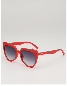 Detail of red geometric sunglasses with gradient lenses and silver wing temple decor