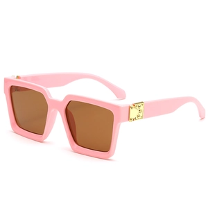 Pink square oversized sunglasses with brown lenses and decorative gold hinges