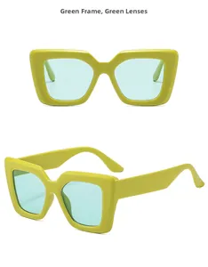 Detail view of large retro green frame sunglasses with translucent green lenses