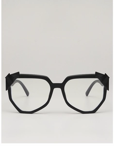 Detail of matte black irregular geometric sunglasses frame with 3D origami hinge design