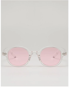 Detail view of oval pink lenses and transparent fashion frames on these sunglasses