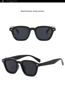 Close-up of square sunglasses with black frame, gray lenses, and silver rivet detail