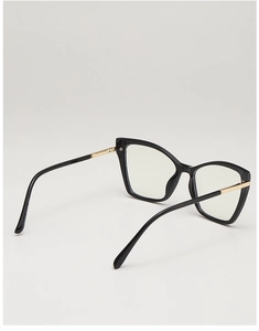 Detail of cat eye glasses frame showing gold metal hinges and sleek black temples
