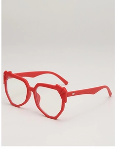 Macro detail of red geometric glasses frame with 3D diamond cut and silver metal logo