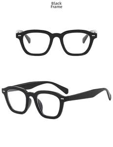Detail view of retro square black frames with clear lenses from front and side angles