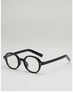 Detailed side view of black oval sunglasses with metallic silver hinge accents