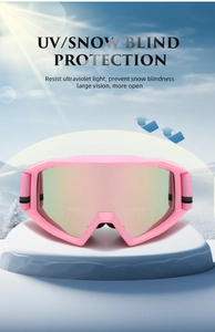Pink anti-fog ski goggles with polarized lens on snow mountain backdrop