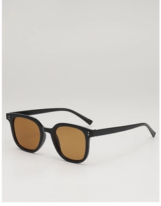 Detail view of square black retro sunglasses with silver studs and brown lenses