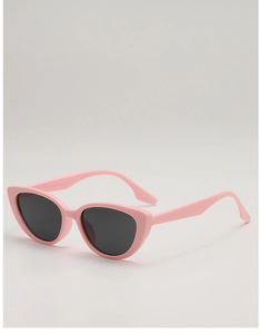 Close-up of pink cat eye sunglasses with grey lenses and lightweight frames