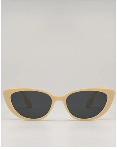 Front view of cream cat-eye sunglasses with dark grey lenses and a high-quality resin frame