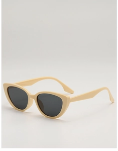 Side view detail of retro cat-eye sunglasses with cream resin frames and dark lenses