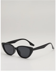 Detail view of vintage cat-eye sunglasses with black frame and dark UV lenses
