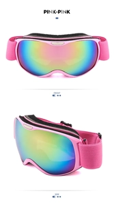 Close-up of kids ski goggles with pink frame, colorful lenses and soft foam padding