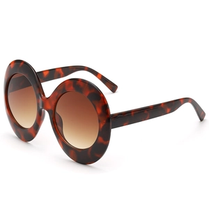 Retro oversized oval sunglasses with tortoise shell frames and brown gradient lenses