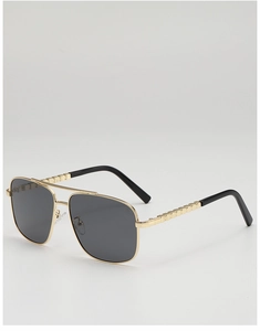 Detail of pilot sunglasses with gold metal frame and textured square embossed temples