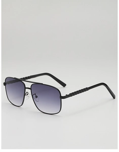 Close-up of pilot sunglasses with geometric textured metal temples and gradient lenses
