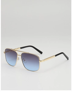 Detailed side view of aviator sunglasses with gold metal frame and gradient lenses