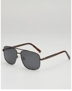 Detail view showing textured metal temples and dark brown aviator frame sunglasses