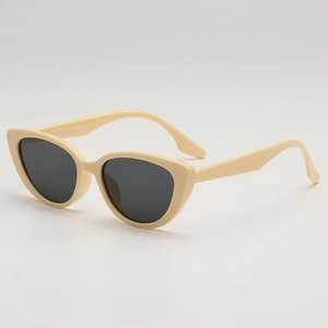 Retro cream cat-eye sunglasses with dark grey lenses and wide frames for women
