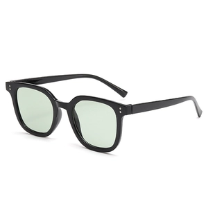 Classic square black sunglasses with mint green lenses and silver rivet detailing
