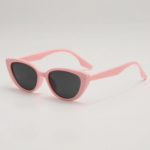 Retro pink cat eye sunglasses with dark lenses for women on a light grey background