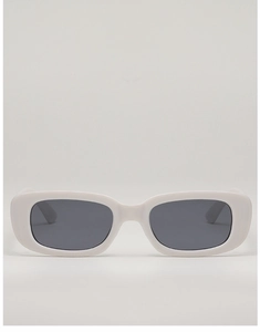 Close-up of retro rectangular children's sunglasses with white frames and grey lenses