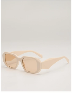 Detail view of stylish retro sunglasses with cream geometric frame and light orange lenses