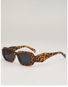 Detail of tortoise shell rectangle sunglasses with dark lenses and thick frames