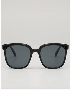 Front view of black square oversized sunglasses with silver metal rivets on the corners