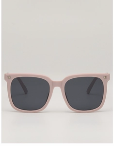 Detail of square pink kids sunglasses with star metal studs and dark polarized lenses
