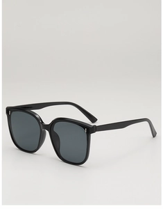 Detail view of square black sunglasses showing silver vertical metal rivets on frame corner