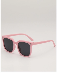 Close-up of pink square kids sunglasses with silver star rivets and dark lenses