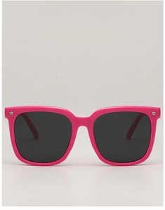 Detail of pink oversized kids sunglasses with silver star studs and dark lenses