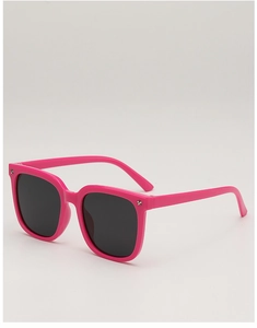 Detail of pink square frame kids sunglasses featuring silver star studs and black lenses