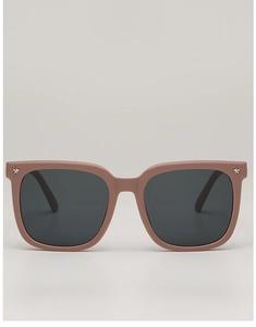 Macro detail of dusty pink matte kids sunglasses frame with silver star rivets