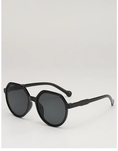 Detailed view of black oversized polygonal sunglasses with dark lenses and thick temples