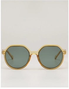 Close-up of translucent amber resin sunglasses frame with dark gray-green lenses