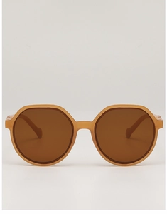 Detail of amber translucent oversized geometric frames with brown UV protection lenses