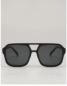 Close-up of black oversized aviator sunglasses with high-gloss double bridge design