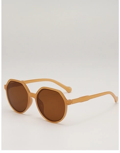 Detail view of stylish tortoiseshell octagonal sunglasses with brown translucent frames