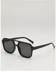 Detail view of classic black double-bridge aviator sunglasses with dark grey lenses