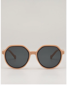 Front view of nude pink hexagonal sunglasses with dark grey lenses and a glossy frame