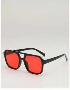 Flat lay of oversized square sunglasses with black frames and gradient red lenses