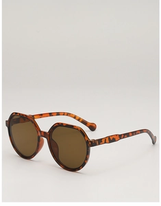 Close-up of tortoise shell sunglasses frame with high-quality brown tinted lenses