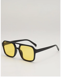 Detail of square oversized sunglasses with yellow lenses and double bridge black frame