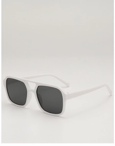 Detail view of white square frame sunglasses with dark lenses from a 45-degree angle
