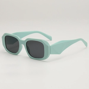 Modern mint green geometric sunglasses with dark UV400 lenses shown at a 45-degree angle