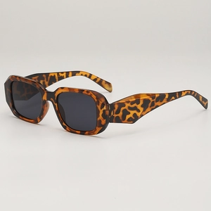 Modern tortoiseshell geometric sunglasses with black UV400 lenses in a stylish 45-degree view