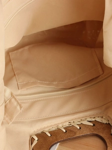Semi-circular woven straw bag featuring fabric lining, inner zipper pocket, and wooden handle