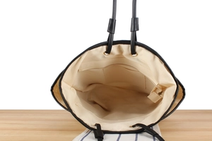 Top view showing the spacious interior with zippered pocket and beige fabric lining